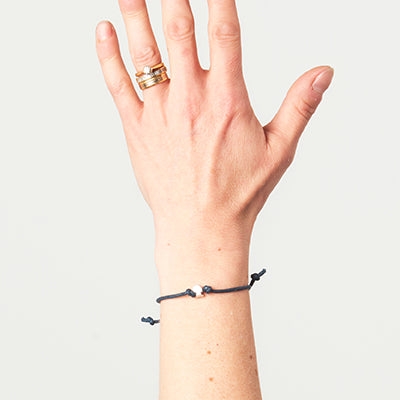 brainstrust string bracelets with silver head